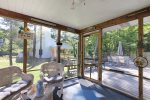 Just off the kitchen is this lovely screen porch perfect for your morning coffee